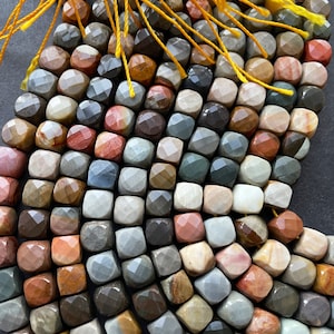 AA natural ocean jasper stone bead . Faceted 7mm cube shape. Beautiful natural brown creamy multi color ocean jasper bead .Full strand 15.5”