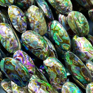 Natural abalone shell bead. About 15x25mm oval shape. Gorgeous natural rainbow purple green peacock color abalone shell bead. Full strand 15