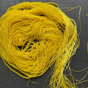 Beautiful yellow crystal stone bead . Faceted 2mm round bead . Gorgeous yellow color. Real nice quality crystal bead. Full strand 14”