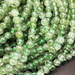 AAA Natural green turmaline quartz. Smooth 4mm round bead . Gorgeous natural green color with black hairs. Full strand 15.5”