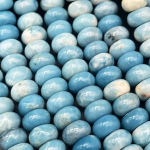 Beautiful natural blue Larimar quartz. 5x8mm 6x9mm Rondelle Shape. Gorgeous blue Larimar color. High polished gemstone bead!