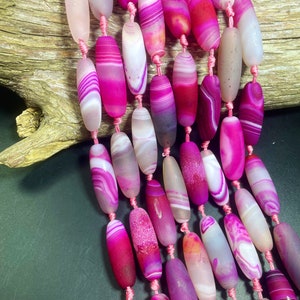 Beautiful natural matte pink Botswana stone bead. 14x40mm barrel shape. Gorgeous pink color Botswana gemstone bead. High quality bead!