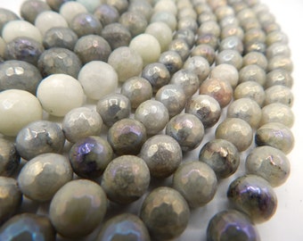 May include: A strand of grey and white faceted gemstone beads. The beads have a slightly iridescent sheen.