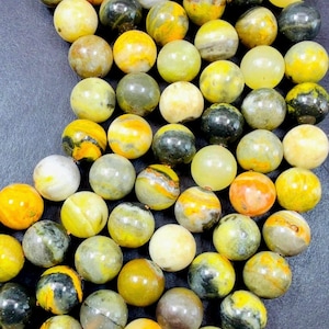 AAA Natural Eclipse stone. 6mm 8mm 10mm round bead . Beautiful natural yellow bee color with brown. High quality Eclipse stone.