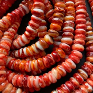 AAA   Natural spiny oysters shell . 6x10mm Rondelle Shape spiny oyster shell . Beautiful natural orange color bead . Great quality.full 15.5