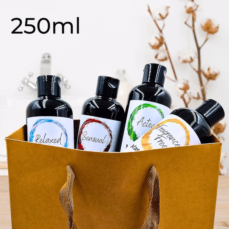 May include: Four 250 ml bottles of body wash in a brown paper bag. The bottles are labeled "Relaxed", "Sensual", "Active", and "Fragrance Free".