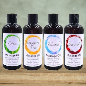 May include: Four amber glass bottles of massage oil with labels. The labels are white with a circle in the center. The circles are green, yellow, blue, and red. The text on the labels reads "Active", "Fragrance Free", "Relaxed", and "Sensual". Each label also includes the text "Massage Oil" and "Tender Essence".
