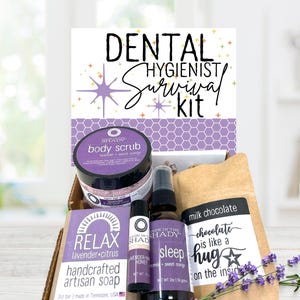 May include: A gift box labeled Dental Hygienist Survival Kit containing a body scrub, a bar of lavender citrus soap, a lavender honey lip balm, a sleep spray, and a bag of milk chocolate. The items feature purple and brown labels with text.