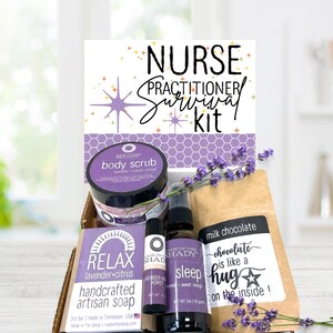 May include: A gift box labeled Nurse Practitioner Survival Kit containing a body scrub, a bar of lavender citrus soap, a lavender mint honey lip balm, a sleep spray, and a milk chocolate bar, all decorated with sprigs of dried purple lavender.