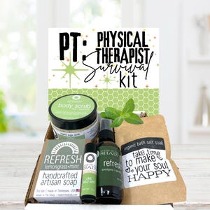 May include: A gift box labeled PT: Physical Therapist Survival Kit containing a jar of lime and spearmint body scrub, a bar of lemongrass and mint handcrafted artisan soap, a lime and wild mint lip balm, a lemongrass and mint spray, and bath salts.