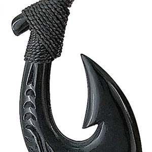 May include: Black carved hook pendant necklace with a black cord. The hook is detailed with a traditional design.