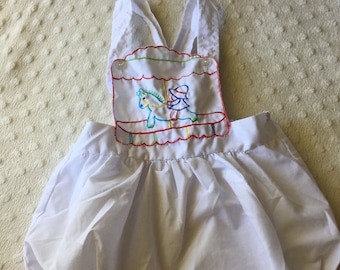 Vintage baby bubble romper/sunsuit/onesie with merry go round motif. Approx size 1.