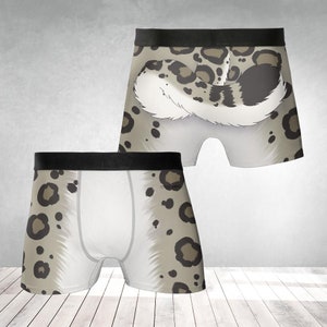 以下が含まれることがあります： 白地に茶色と白の雪豹柄がプリントされたボクサーパンツ。雪豹の尻尾と尻がプリントされている