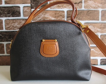 Bolso bandolera de piel negra vintage Courrèges Paris con asa superior y doble asa.