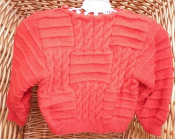 Red baby's cable sweater is very stylish and fits an 18 inch underarm or a 6 month old.