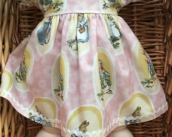 An adorable pink mid length dress and matching panties to fit a 16 inch  Cabbage Patch Doll.