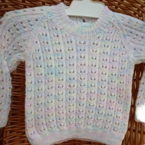 Baby's knitted sweater fits an 18 inch underarm or a 0-3 month old. image 1