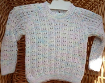 Baby's knitted sweater fits an 18 inch underarm or a 0-3 month old.