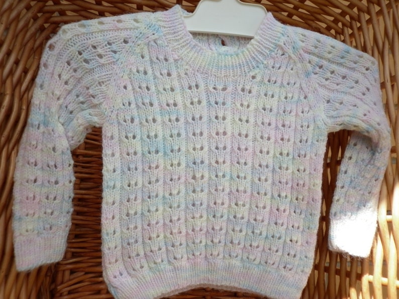 Baby's knitted sweater fits an 18 inch underarm or a 0-3 month old. image 1
