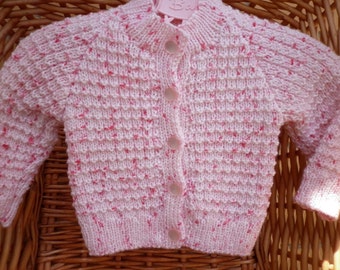 Baby's pink flecked cardigan which fits a 16 inch underam or a 0-3 month old.