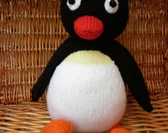 Sitting Pingu the penguin is designed by Alan Dart and is ready to ship