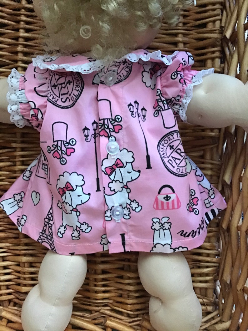 Fits a 14 inch Cabbage Patch Doll a pretty pink with a French theme knee length dress and matching panties