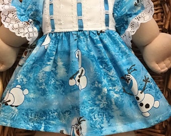 A pretty blue Frozen themed dress with white yoke and matching white panties to fit a 16 inch Cabbage Patch Doll.