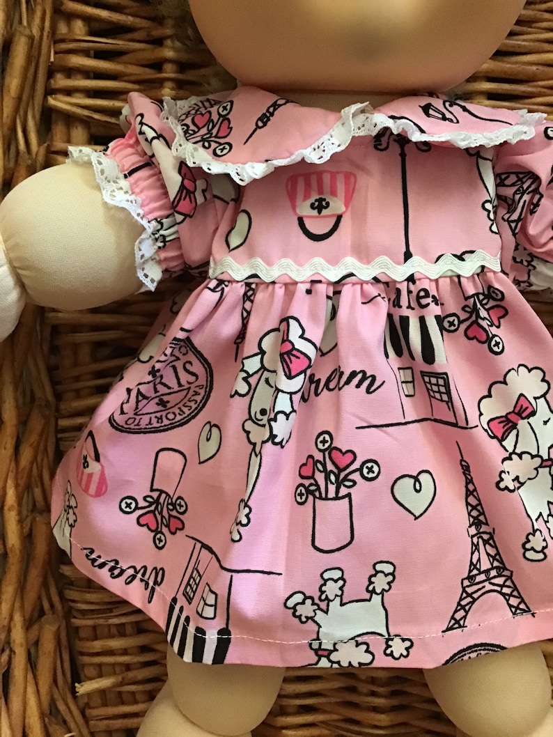 Fits a 14 inch Cabbage Patch Doll a pretty pink with a French theme knee length dress and matching panties