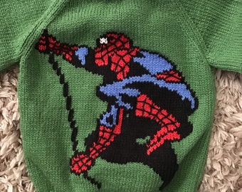 This sweater fits a 22 inch chest or a 1-2 year old approximately and has Spiderman embroidered on the front and is knitted in green