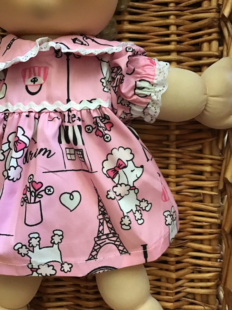 Fits a 14 inch Cabbage Patch Doll a pretty pink with a French theme knee length dress and matching panties