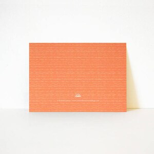 May include: A blank orange card with a white logo that says "Knitted Lemon" and a website address.