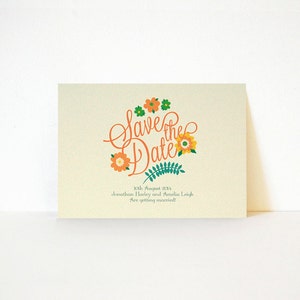 May include: Save the Date card with a floral design in orange, yellow, and green. The text reads "Save the Date" with the date "10th August 2014" and the names "Jonathan Harley and Amelia Leigh" followed by "Are getting married!"