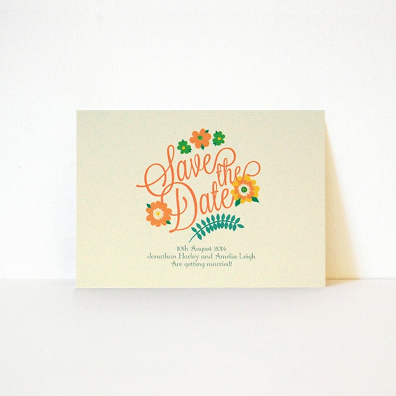 May include: Save the Date card with a floral design in orange, yellow, and green. The text reads "Save the Date" with the date "10th August 2014" and the names "Jonathan Harley and Amelia Leigh" followed by "Are getting married!"