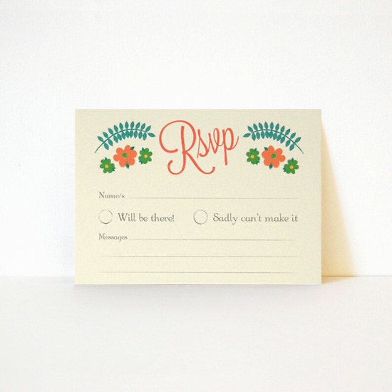 May include: A light beige RSVP card with a floral design in shades of green, orange, and white. The text "RSVP" is written in red cursive. The card has two options for guests to choose from: "Will be there!" or "Sadly can't make it".