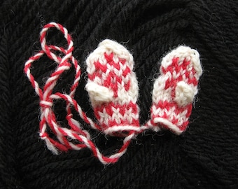 Snowflake ornament mittens, often used as Christmas tree ornaments. Small size.