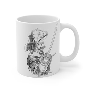 May include: White ceramic mug featuring a black and white illustration of a man in a hat holding a sword. The illustration has a detailed, pen-and-ink style, depicting a historical figure. The mug has a standard handle and a glossy finish.