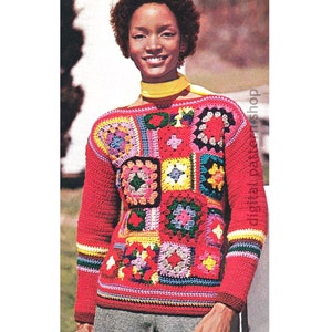 May include: A red crochet sweater with a colorful patchwork design featuring squares of different colors and patterns. The sweater has a boat neck and long sleeves.