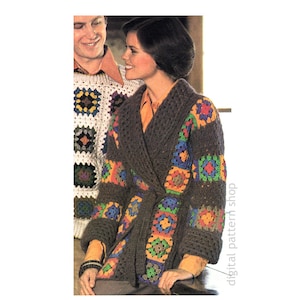 May include: A brown crochet cardigan with a colorful granny square pattern. The cardigan has a tie belt and is worn by a person with short brown hair.