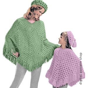 May include: Two crocheted ponchos, one green and one pink, with matching crocheted hats. The ponchos have fringe trim and are made with a lacy stitch.
