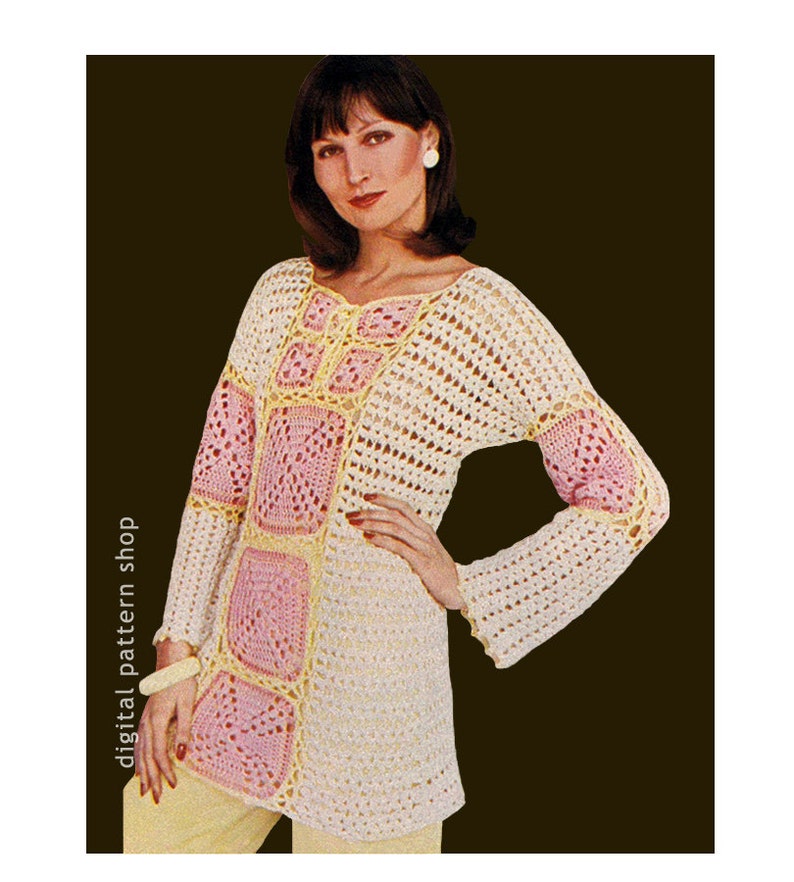 May include: A crocheted top with a square pattern in pink and yellow. The top has long sleeves and a loose fit.