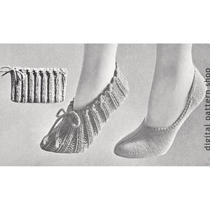 May include: A pair of knitted slipper socks with a gathered elastic top and a tied bow. The socks are shown on a model's feet. The image also shows a close-up of the knitted fabric.