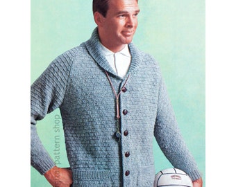 May include: A light blue knitted cardigan with a shawl collar, button closure, and a patch pocket. The cardigan is worn by a person holding a white volleyball.