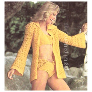 May include: A yellow crochet swimsuit with a matching cardigan. The swimsuit has a halter top and high-waisted bottoms. The cardigan has a hood and long sleeves.