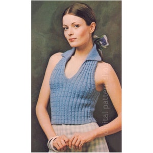 May include: A blue knitted halter top with a collar. The top has a v-neck and is sleeveless.
