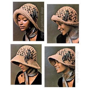 Può includere: Un cappello all'uncinetto con un'ampia tesa e un fiocco di fiori all'uncinetto come ornamento. Il cappello è di colore marrone chiaro con un motivo marrone più scuro. Il cappello è indossato da una persona con la pelle scura.