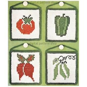 May include: Four square crochet wall hangings featuring vegetables: a red tomato, a green bell pepper, red radishes, and green pea pods. Each square has a white background, a green border, and a green hanging loop. The text "digital pattern shop" is at the top.