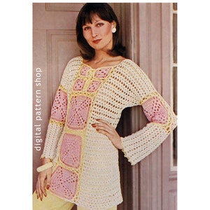 May include: A crochet top with a square pattern in pink and yellow. The top has long sleeves and a loose fit.