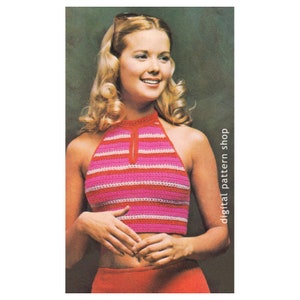 May include: A crochet halter top with pink and white stripes. The top has a keyhole opening at the neckline.