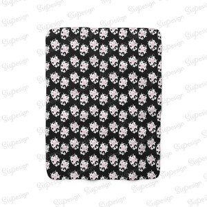 May include: Black and white fabric with a repeating pattern of pink and white cow faces.