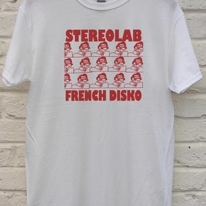 May include: A set of three ceramic mugs with a speckled, matte finish in cream, light grey, and dark grey. Each mug has a simple, minimalist design and a rounded handle.